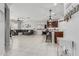 A living area flows to the kitchen that features an island and stainless appliances, perfect for modern living at 14419 W El Cortez Pl, Surprise, AZ 85387