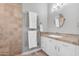 Elegant bathroom features a stone wall and heated towel rack for ultimate comfort at 15716 W Sheridan St, Goodyear, AZ 85395