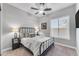 Comfortable bedroom featuring a sleek ceiling fan and modern decor at 15716 W Sheridan St, Goodyear, AZ 85395