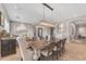Open-concept dining area with stylish lighting and seamless flow into the living spaces at 15716 W Sheridan St, Goodyear, AZ 85395