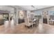 Elegant dining room with modern chandelier and view of the outdoor space at 15716 W Sheridan St, Goodyear, AZ 85395