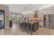 Bright kitchen featuring a large island, modern appliances, and a breakfast bar at 15716 W Sheridan St, Goodyear, AZ 85395