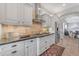 Well-appointed kitchen featuring granite counters, and stainless appliances at 15716 W Sheridan St, Goodyear, AZ 85395