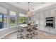 Eat-in kitchen featuring a center island with bar seating, large windows and backyard views at 15716 W Sheridan St, Goodyear, AZ 85395