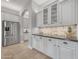 Spacious kitchen with stainless steel appliances, granite counters, and ample cabinet space at 15716 W Sheridan St, Goodyear, AZ 85395