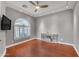 Hardwood living room with window shutters and modern lighting at 15716 W Sheridan St, Goodyear, AZ 85395