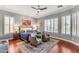 Cozy main bedroom featuring a ceiling fan, plantation shutters, and recessed lighting at 15716 W Sheridan St, Goodyear, AZ 85395
