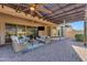 Spacious covered patio with ceiling fans, offering seamless indoor-outdoor living and entertaining space at 15716 W Sheridan St, Goodyear, AZ 85395