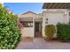 Charming front exterior with desert landscaping, secure gated entry, and shade trellis over the front courtyard at 15801 N 29Th St # 16, Phoenix, AZ 85032