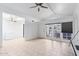 Open-concept living space with vaulted ceilings and tile flooring, featuring a dining area with access to the outdoors at 15801 N 29Th St # 16, Phoenix, AZ 85032