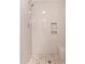 Beautifully renovated shower with neutral tiling, pebble floor and built in niche for all your shower essentials at 15801 N 29Th St # 16, Phoenix, AZ 85032