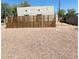 A long flat backyard that is primarily xeriscaped with a DIY plank fence in the foreground at 1731 E Moreland St, Phoenix, AZ 85006
