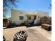 A single Gathering home with a partially xeriscaped yard featuring a DIY fire pit and a ladder at 1731 E Moreland St, Phoenix, AZ 85006