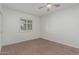 Comfortable bedroom featuring a window and wood-look floors at 1822 W Rose Ln, Phoenix, AZ 85015