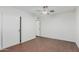 Bright bedroom with wood-look flooring and a ceiling fan for comfortable living at 1822 W Rose Ln, Phoenix, AZ 85015