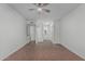Spacious bedroom featuring a ceiling fan and ensuite bathroom with white walls at 1822 W Rose Ln, Phoenix, AZ 85015
