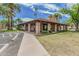 Community clubhouse surrounded by lush landscaping and palm trees at 1822 W Rose Ln, Phoenix, AZ 85015