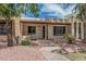 Charming single-story home with a covered porch, desert landscaping, and a brick walkway at 1822 W Rose Ln, Phoenix, AZ 85015