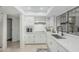 Well-lit kitchen featuring modern stainless steel appliances and white cabinets at 1822 W Rose Ln, Phoenix, AZ 85015