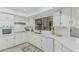 Updated kitchen with stainless sink and white cabinets with modern pulls at 1822 W Rose Ln, Phoenix, AZ 85015