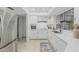 Bright kitchen featuring stainless steel appliances and white cabinets at 1822 W Rose Ln, Phoenix, AZ 85015