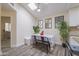 Bright dining area featuring skylight, modern table set, and charming decorative accents at 18843 N 45Th Ave, Glendale, AZ 85308