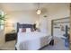 Comfortable main bedroom boasts natural light, neutral tones, and ample closet space at 18843 N 45Th Ave, Glendale, AZ 85308