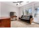 Well-lit bedroom features a futon and carpeted floor at 198 N Nevada Way, Gilbert, AZ 85233