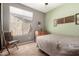 Inviting bedroom features neutral tones, natural light, and closet at 198 N Nevada Way, Gilbert, AZ 85233