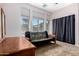 Well-lit bedroom features a futon and carpeted floor at 198 N Nevada Way, Gilbert, AZ 85233