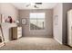 Well-lit bedroom features a neutral walls and carpeted floor at 198 N Nevada Way, Gilbert, AZ 85233
