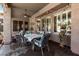 Covered patio featuring dining table, chairs, ceiling fan, and decorative details at 198 N Nevada Way, Gilbert, AZ 85233