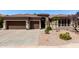 Charming single-story home featuring a well-manicured gravel front yard, desert landscaping, and a spacious three-car garage at 198 N Nevada Way, Gilbert, AZ 85233