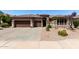 Charming single-story home featuring a three-car garage and desert landscaping at 198 N Nevada Way, Gilbert, AZ 85233