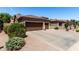 Charming single-story home featuring a well-manicured gravel front yard, desert landscaping, and a spacious three-car garage at 198 N Nevada Way, Gilbert, AZ 85233