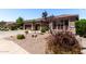 Charming single-story home featuring a well-manicured gravel front yard, desert landscaping, and a spacious three-car garage at 198 N Nevada Way, Gilbert, AZ 85233