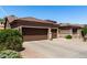 Charming single-story home featuring a well-manicured gravel front yard, desert landscaping, and a spacious three-car garage at 198 N Nevada Way, Gilbert, AZ 85233