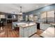 Modern kitchen features granite countertops, a kitchen island, and updated appliances at 198 N Nevada Way, Gilbert, AZ 85233