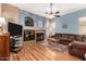 Comfortable living room features a cozy fireplace and a stylish decor at 198 N Nevada Way, Gilbert, AZ 85233