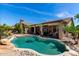 Beautiful backyard features a private pool and well-manicured desert landscaping at 198 N Nevada Way, Gilbert, AZ 85233
