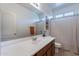Bathroom features a long vanity with a large mirror, and a shower/tub combination at 21277 E Cherrywood Dr, Queen Creek, AZ 85142