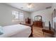 Bright bedroom features wood floors, ceiling fan and window for plenty of natural light at 21277 E Cherrywood Dr, Queen Creek, AZ 85142