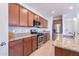 Updated kitchen with granite counters, stainless steel appliances, and a functional layout for cooking and entertaining at 21277 E Cherrywood Dr, Queen Creek, AZ 85142