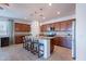 Stylish kitchen with granite countertops, stainless steel appliances, and a central island with seating at 21277 E Cherrywood Dr, Queen Creek, AZ 85142