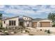 Stylish single-story home featuring desert landscaping, a multi-car garage, and stone accents at 22482 S 180Th Pl, Queen Creek, AZ 85142