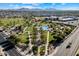 Aerial shot showing a community park, pool, and homes, with mountains visible in the distance under a blue sky at 22842 E Via Las Brisas --, Queen Creek, AZ 85142