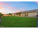 Spacious backyard with lush green lawn and covered patio, perfect for outdoor living at 22842 E Via Las Brisas --, Queen Creek, AZ 85142