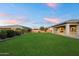Beautiful backyard featuring a manicured lawn and mature landscaping for privacy and appeal at 22842 E Via Las Brisas --, Queen Creek, AZ 85142
