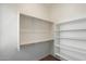 Bright closet with built-in shelving and clothing rods for optimal organization and storage at 22842 E Via Las Brisas --, Queen Creek, AZ 85142