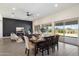 Open-concept dining and living area with large windows and access to the backyard at 22842 E Via Las Brisas --, Queen Creek, AZ 85142